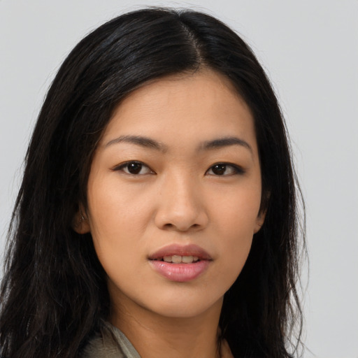 Joyful asian young-adult female with long  black hair and brown eyes
