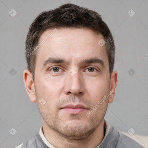 Neutral white adult male with short  brown hair and brown eyes