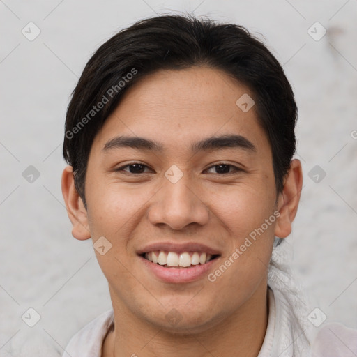 Joyful asian young-adult male with short  brown hair and brown eyes