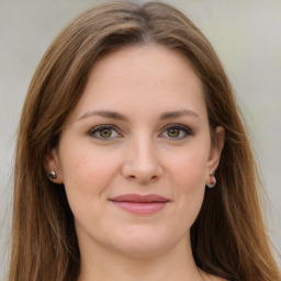 Joyful white young-adult female with long  brown hair and green eyes