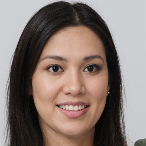 Joyful white young-adult female with long  brown hair and brown eyes