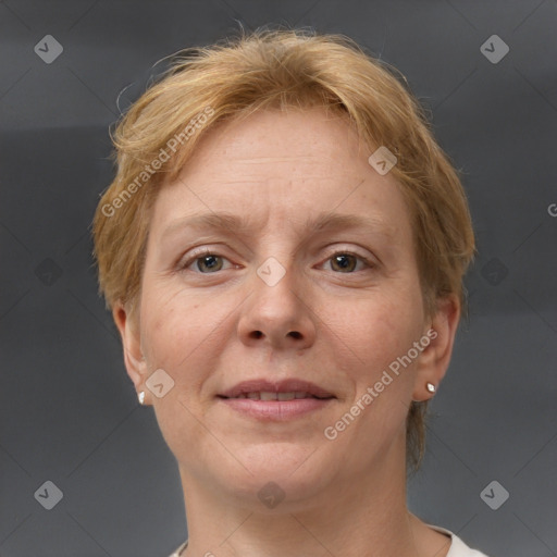 Joyful white adult female with short  brown hair and grey eyes