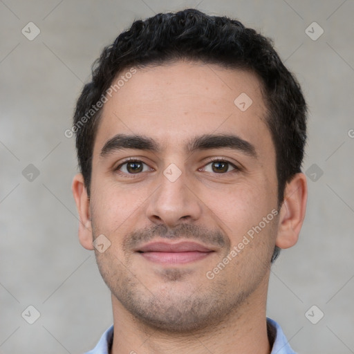 Joyful white young-adult male with short  black hair and brown eyes