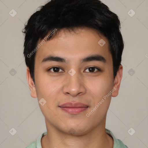 Joyful asian young-adult male with short  brown hair and brown eyes