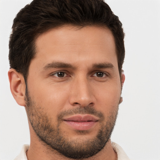 Joyful white young-adult male with short  brown hair and brown eyes