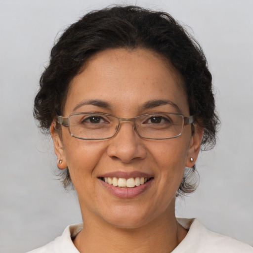 Joyful white adult female with short  brown hair and brown eyes