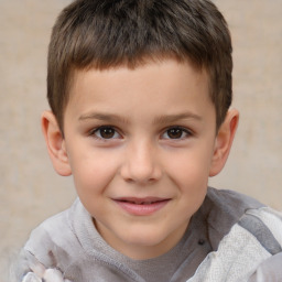 Joyful white child male with short  brown hair and brown eyes