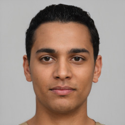 Neutral latino young-adult male with short  black hair and brown eyes