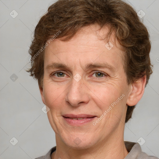 Joyful white adult male with short  brown hair and grey eyes