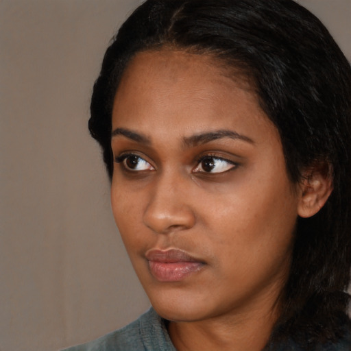 Neutral black young-adult female with long  black hair and brown eyes