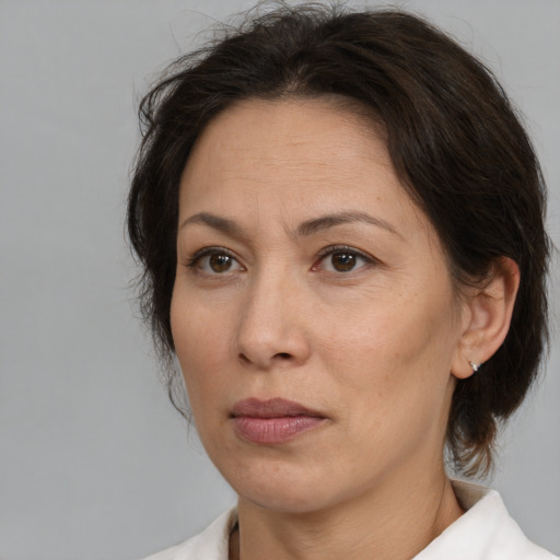 Neutral white adult female with medium  brown hair and brown eyes