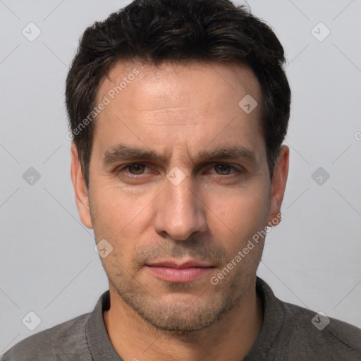 Neutral white adult male with short  black hair and brown eyes