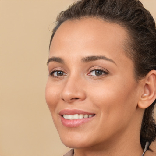 Joyful white young-adult female with medium  brown hair and brown eyes