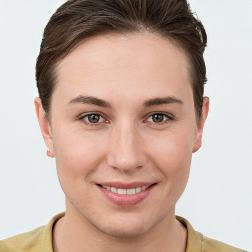 Joyful white young-adult female with short  brown hair and brown eyes