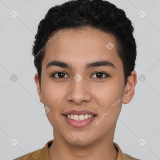 Joyful latino young-adult male with short  brown hair and brown eyes