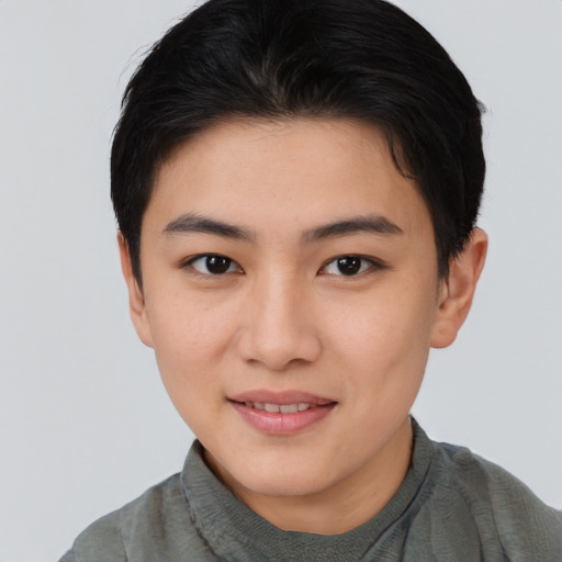 Joyful asian young-adult female with short  brown hair and brown eyes