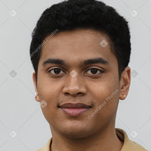 Joyful black young-adult male with short  brown hair and brown eyes