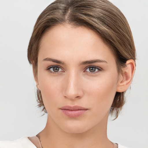 Neutral white young-adult female with medium  brown hair and brown eyes