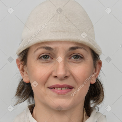 Joyful white adult female with medium  brown hair and grey eyes