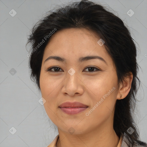 Joyful asian adult female with medium  brown hair and brown eyes