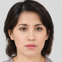 Neutral asian young-adult female with medium  brown hair and brown eyes