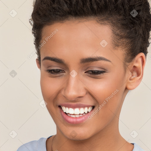 Joyful white young-adult female with short  brown hair and brown eyes