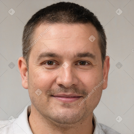 Joyful white adult male with short  brown hair and brown eyes