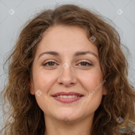 Joyful white adult female with long  brown hair and brown eyes