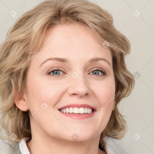 Joyful white young-adult female with medium  brown hair and blue eyes