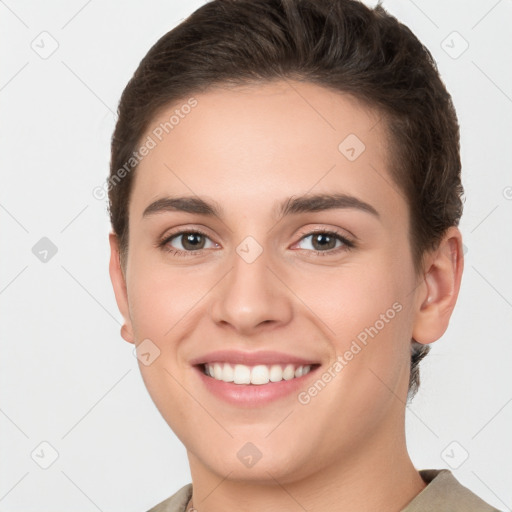 Joyful white young-adult female with short  brown hair and brown eyes