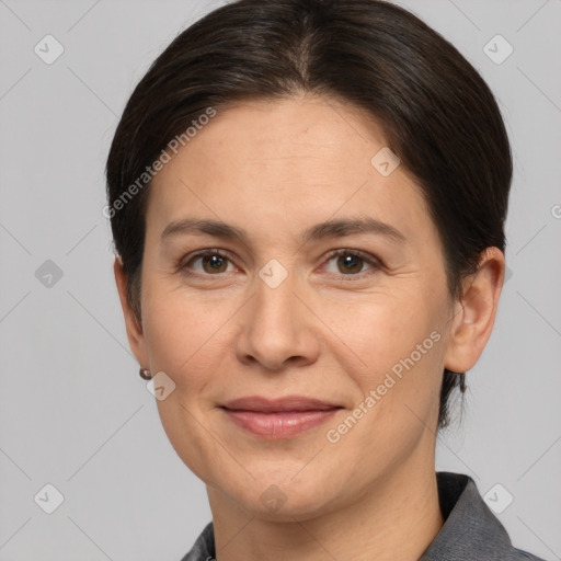 Joyful white adult female with short  brown hair and brown eyes