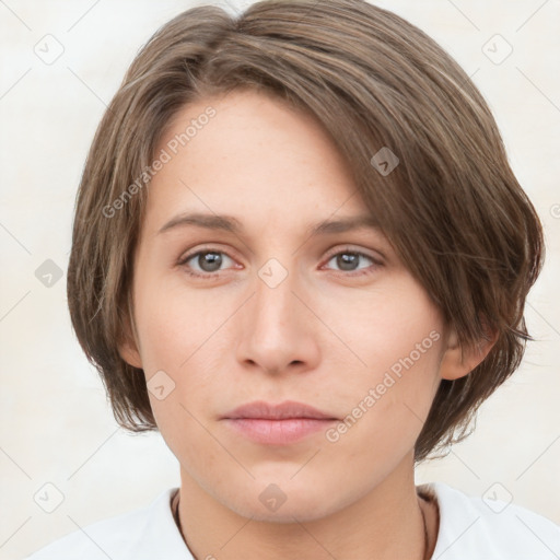 Neutral white young-adult female with medium  brown hair and grey eyes