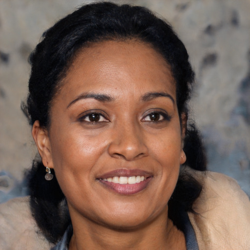 Joyful black young-adult female with medium  brown hair and brown eyes