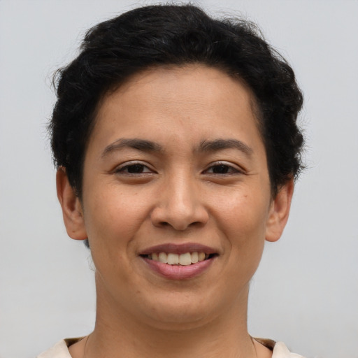 Joyful asian young-adult female with short  brown hair and brown eyes