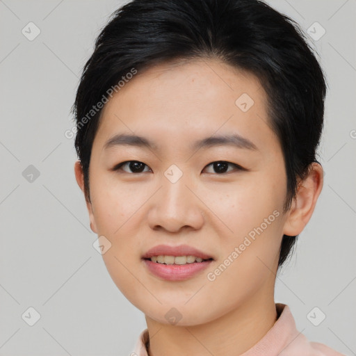 Joyful asian young-adult female with short  black hair and brown eyes