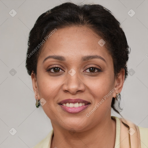 Joyful latino adult female with short  brown hair and brown eyes