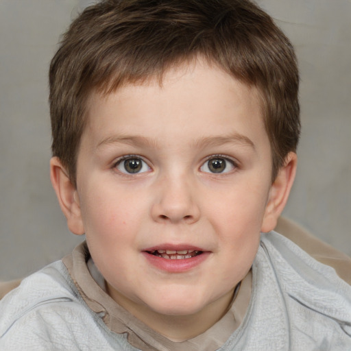 Joyful white child male with short  brown hair and brown eyes