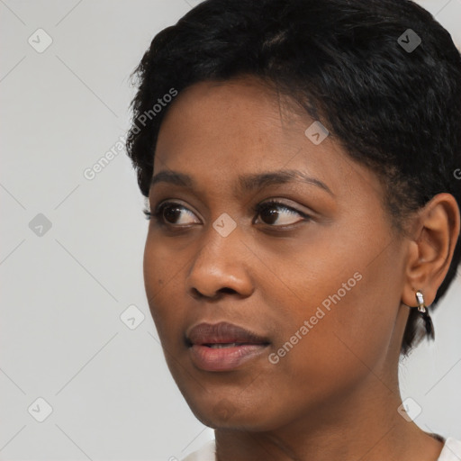 Neutral black young-adult female with short  black hair and brown eyes