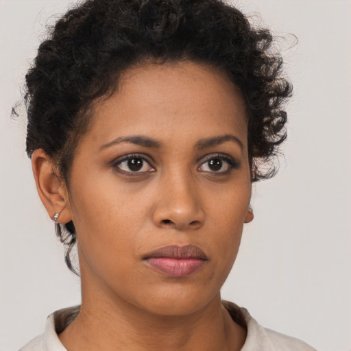 Neutral latino young-adult female with short  brown hair and brown eyes