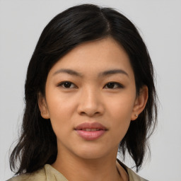 Joyful asian young-adult female with medium  black hair and brown eyes