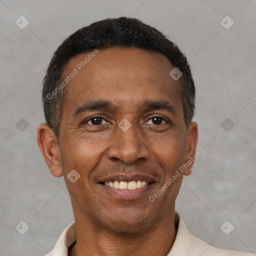 Joyful latino adult male with short  black hair and brown eyes