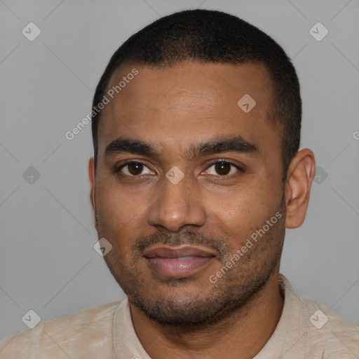 Joyful black young-adult male with short  black hair and brown eyes