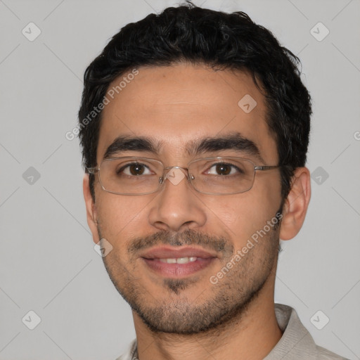 Joyful latino young-adult male with short  black hair and brown eyes