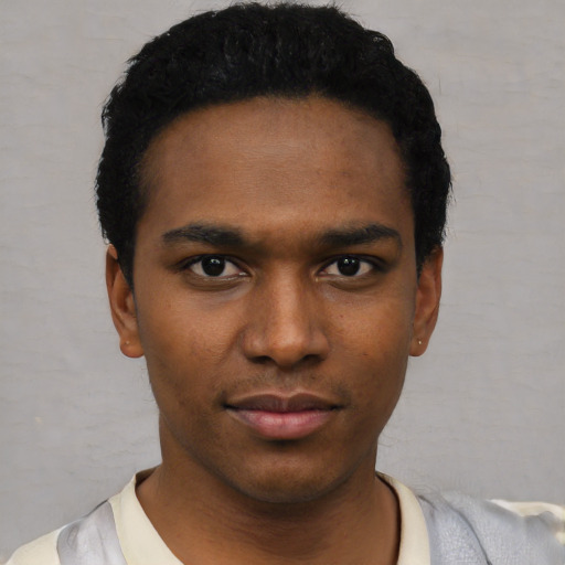 Neutral black young-adult male with short  black hair and brown eyes