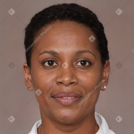 Joyful black adult female with short  brown hair and brown eyes