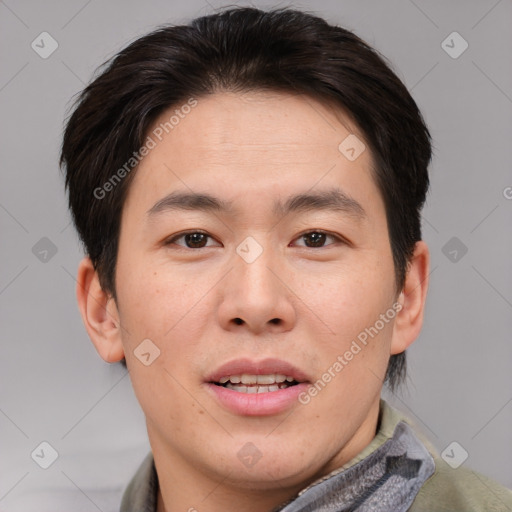 Joyful asian young-adult male with short  brown hair and brown eyes