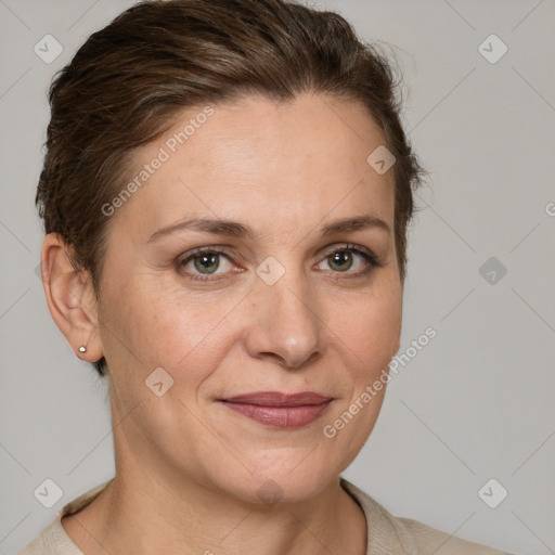 Joyful white adult female with short  brown hair and grey eyes