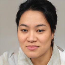 Joyful asian young-adult female with medium  brown hair and brown eyes