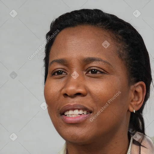 Joyful black young-adult female with short  black hair and brown eyes