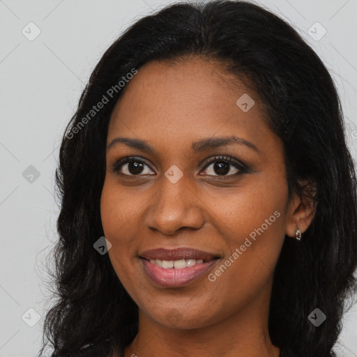 Joyful black young-adult female with long  brown hair and brown eyes